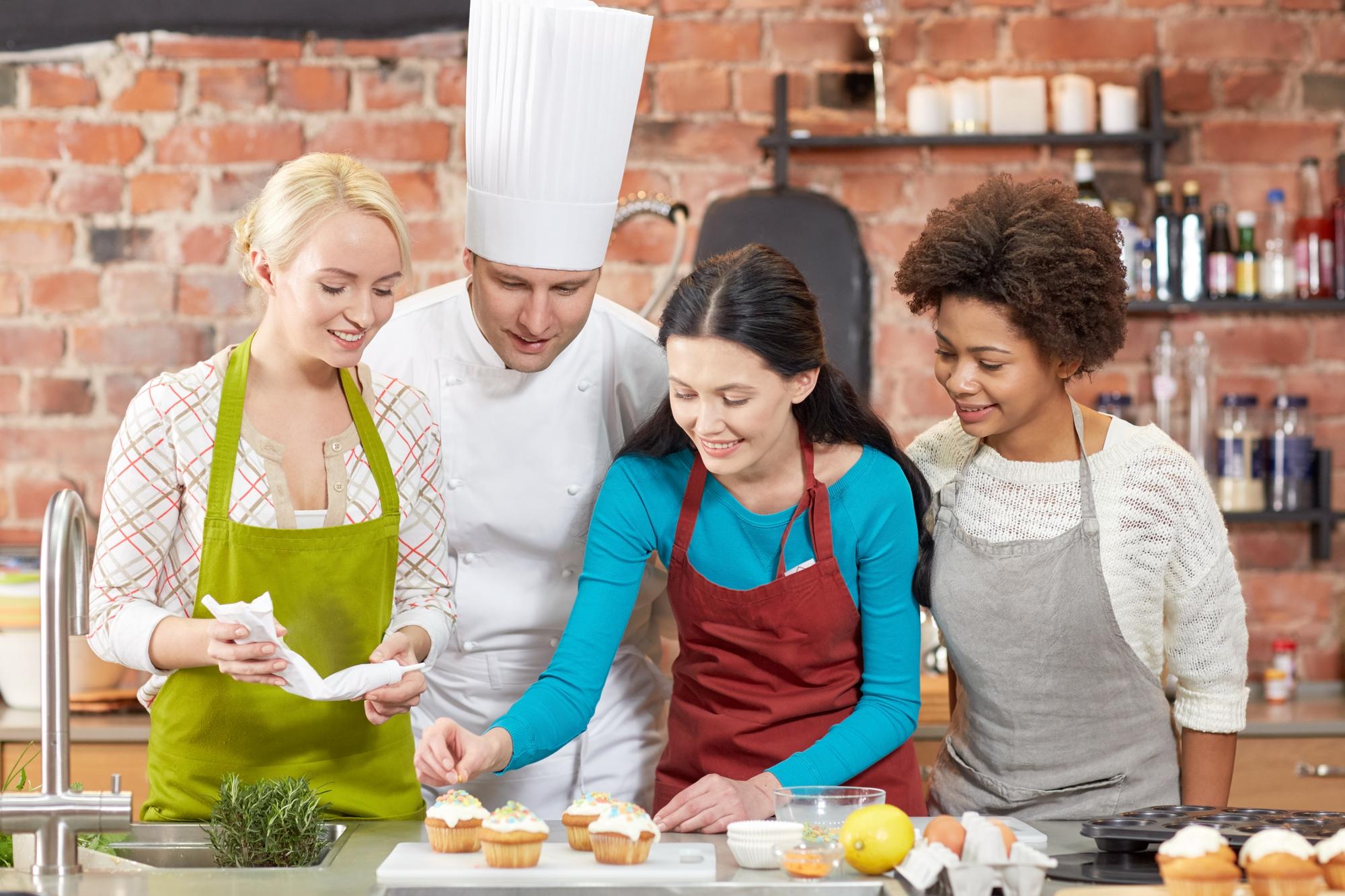 Students working together around a kitchen island