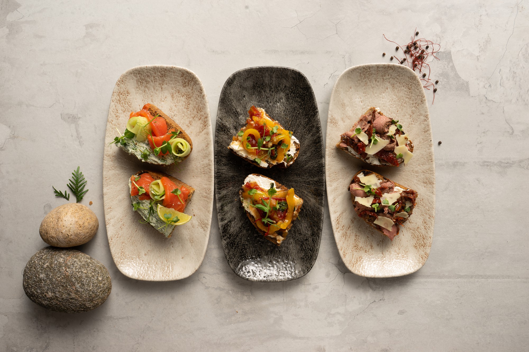Selection of plated dishes on a wooden table